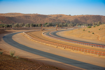 Camel Racing is an Arabian Gulf tradition. This camel race track shows the curve of the sandy track...