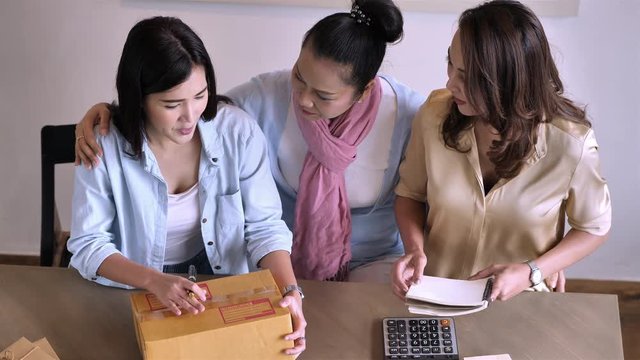 Family business working freelance small business entrepreneur SME at home. Small business owner, online marketing packaging box and delivery concept...