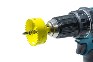 Crownwith a drill and a spring for drilling large-diameter holes