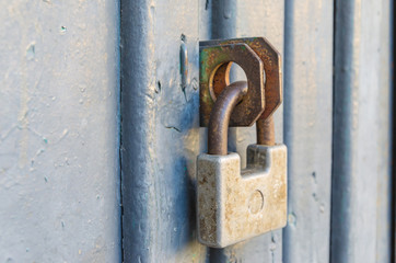 Closed front door with an old padlock.