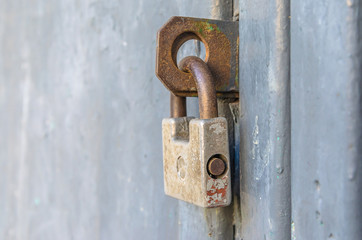 Closed front door with an old padlock.