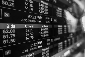 Stock exchange market in black and white on LED screen. Finance and economic concept.