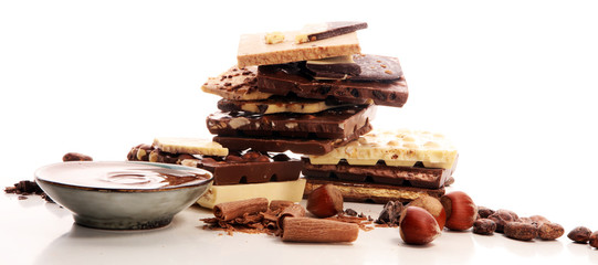 Chocolate bars on table with chocolate tower.