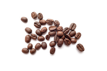 Roasted coffee beans isolated on white background. Close-up.