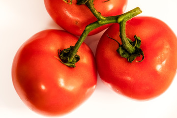 fresh tomatoes isolated on white background