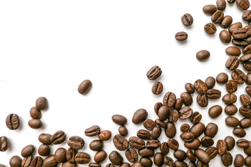 Roasted coffee beans isolated on white background. Close-up.