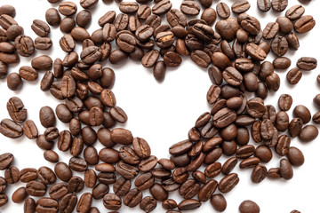 Heart frame of roasted coffee beans with area for copy space.