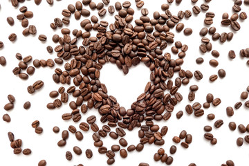 Heart frame of roasted coffee beans with area for copy space.