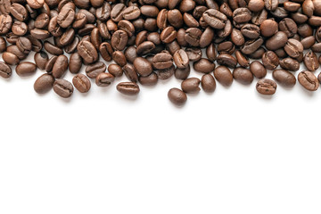 Roasted coffee beans on white background. Close-up.