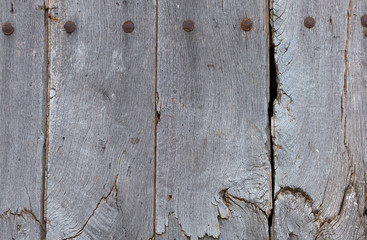 old wooden door with iron forged rivets