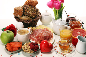breakfast on table with bread buns, croissants, coffe and juice on carnival