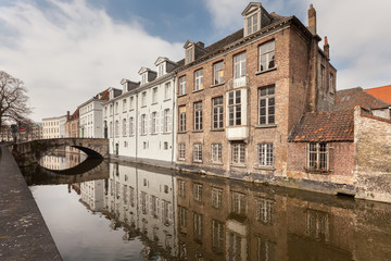 Fototapeta na wymiar Beautiful houses along the canals of Brugge, Belgium. Tourism destination in Europe