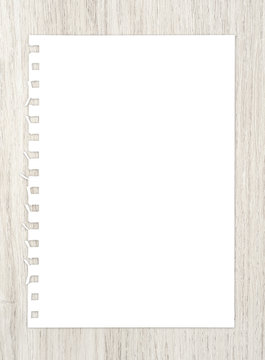 White paper sheet on wood for background.