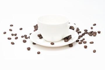 Coffee beans and white coffee cup isolated on a white background.
