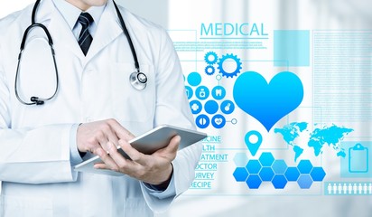Doctor at hospital working with tablet pc