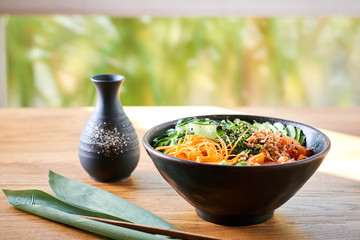 Poke bowl on wooden table