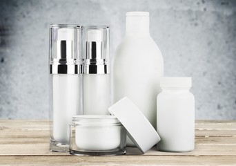 Cosmetic containers isolated on background