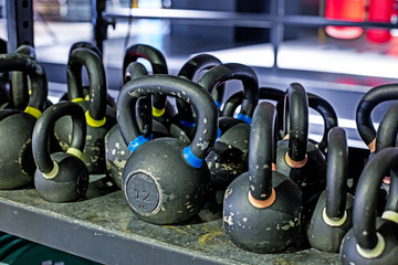 Fototapeta na wymiar kettlebells for burn fat in the body in the sport gym, Healthy lifestyle and sport concept