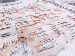 Sawmill, Log storage timber, winter harvesting of wood. Russia, Tomsk