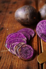 Purple potatoes sliced, selective focus