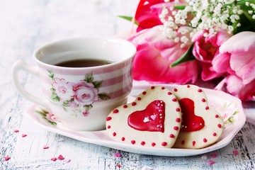 Valentines day food background heart shaped cookies with cup of coffee, selective focus