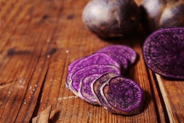 Purple potatoes sliced, selective focus