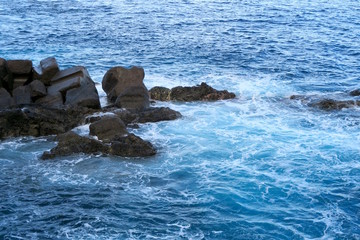 rocks in the blue sea