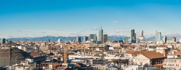 Zelfklevend Fotobehang Milan skyline. Large panoramic view of Milano city, Italy. The mountain range of the Lombardy Alps in the background. Italian landscape. © Arcansél