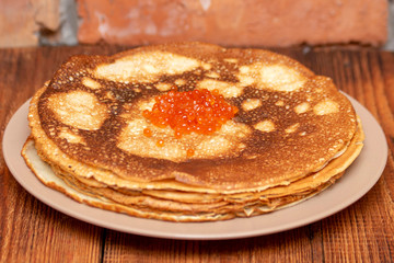 Russian pancakes with red caviar