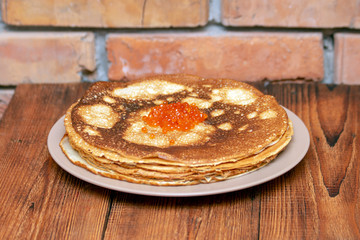 Russian pancakes with red caviar