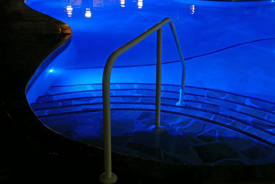 Steps into swimming pool by night