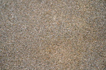Fototapeta na wymiar Close up / macro dark brown and black sand.