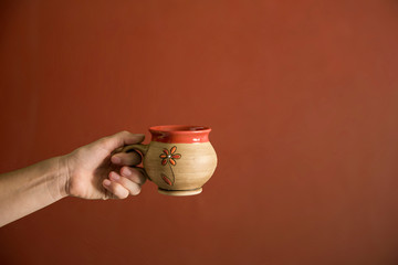 hand with glass of tea
