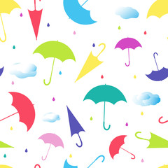 Seamless pattern from umbrellas in different positions, with raindrops and clouds on white background. Colored vector illustration.