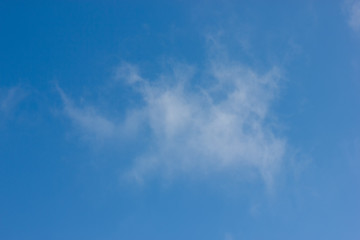 Morning sunrise. Blue sky with clouds. The morning sun illuminates the clouds.