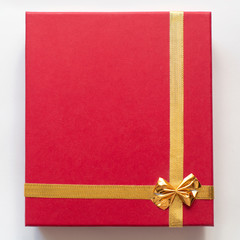 red gift box on white background. Beautiful packaging. A gift to a girl, a woman.