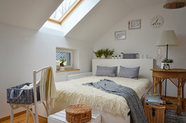 White scandinavian bedroom in the attic