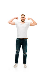 full length view of handsome bearded young man showing biceps and looking at camera isolated on white