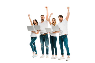 excited young friends with laptops raising hands and smiling at camera isolated on white - Powered by Adobe