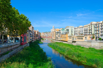 Fototapeta na wymiar View of Eiffel Bridge over River Onyar, Cathedral and buildings of city of Girona, Spain