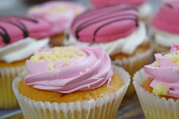 Delicious cakes on wooden background.Sweet dessert for coffee.