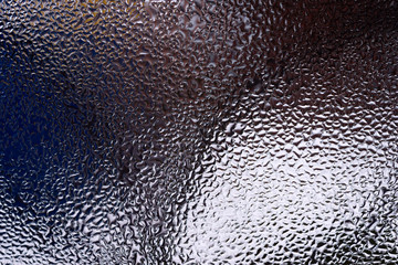 Water drops on glass window close up with blurred background. Drops in macro. Condensate on window...