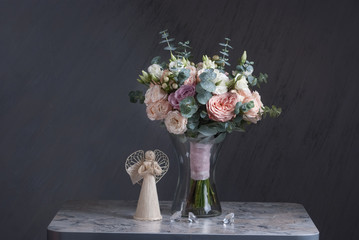 Bouquet of peach and pink roses on gray background. Nice mood