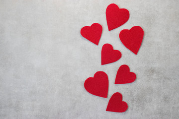 Red decorative hearts on a gray background. Valentine's Day Concept.