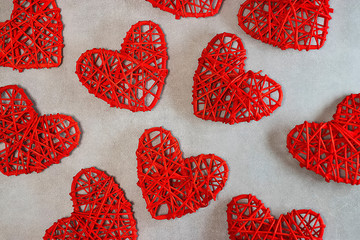 Red decorative hearts on a gray background. Valentine's Day Concept.