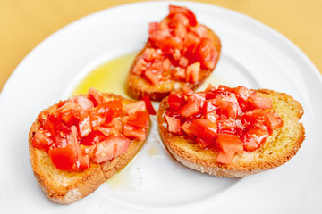 Tuscan bruschetta bread with tomato and olive oil, italian cuisine concept