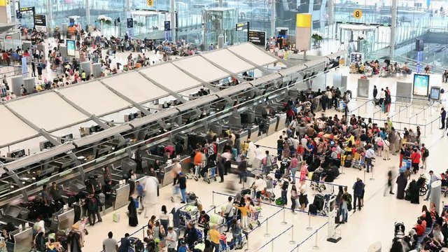 4K Time lapse of crowd passengers at check in counter hall in Suvarnabhumi Airport