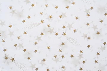 Abstract background with golden stars close-up on a white background