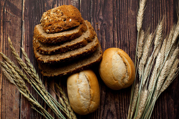Still life with bread. Bread, buns, ears of wheat, dough, flour. 