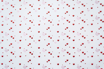 Abstract valentine's day background with red heart symbols on white background